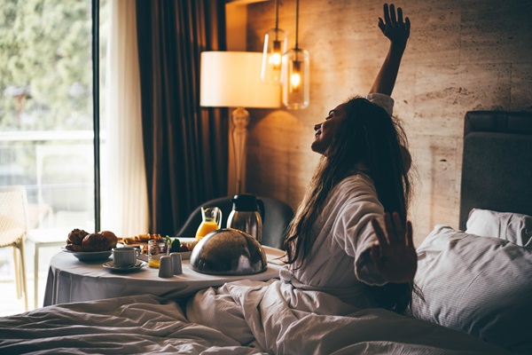 Woman stretches after just waking up