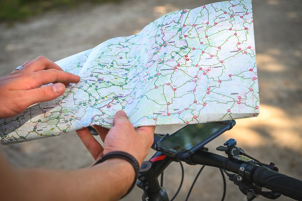 Looking at the cycling map during a bike tour.