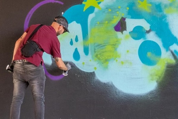 Grafitti artist practices on a vacant spot at the Hall of Fame in Weert